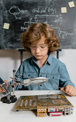 Boy using a microscope