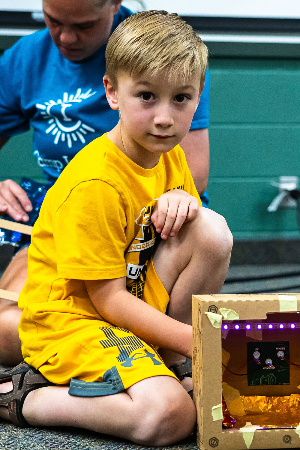 Boy using a microscope